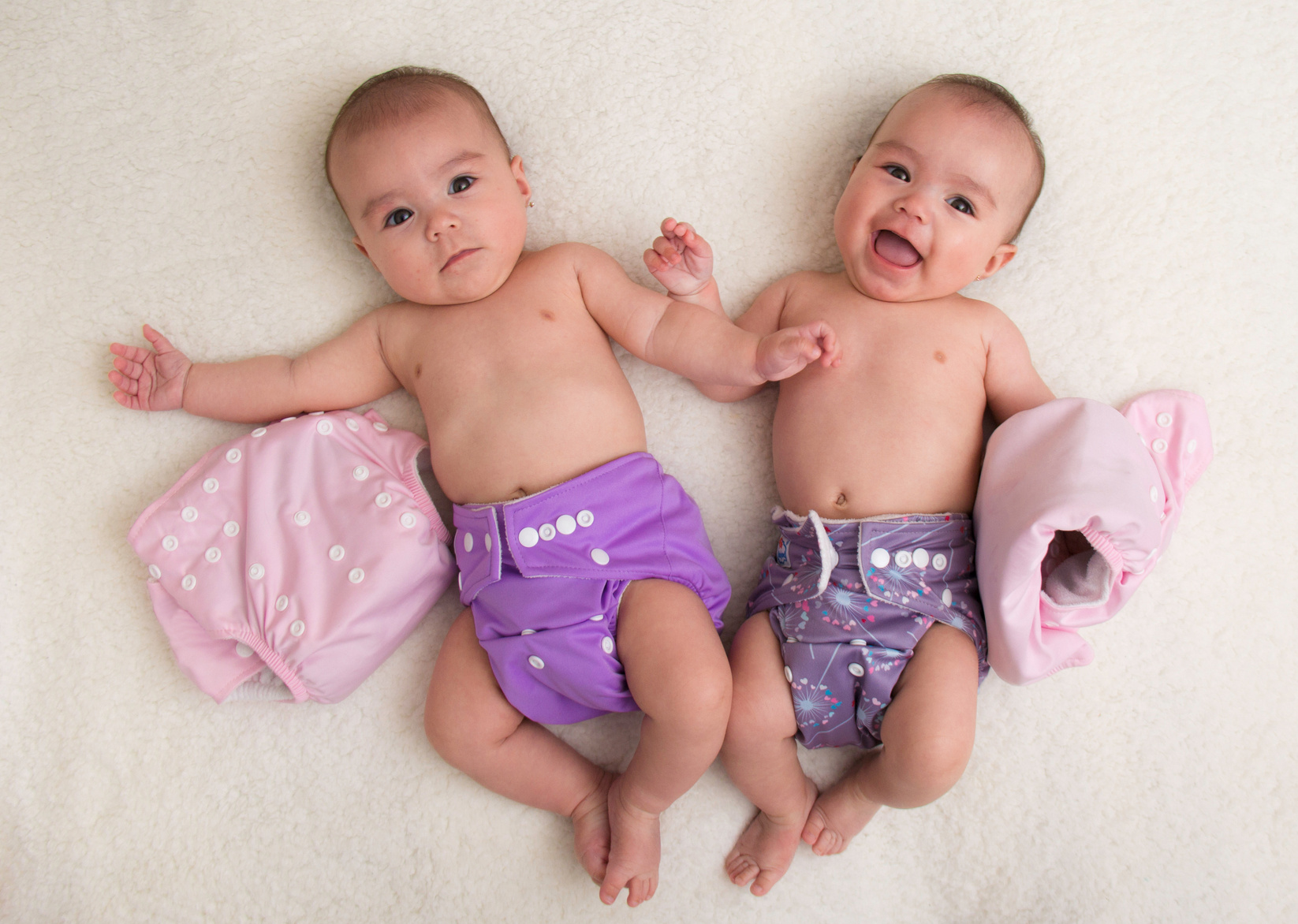 Twin babies girls with ecologic cloth diapers